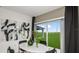 Bright dining area with modern artwork and large windows overlooking a spacious backyard at 12474 Gust Ct, Hudson, FL 34669