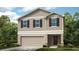 Charming two-story home with attached garage, featuring a well-manicured lawn and traditional architectural details at 12474 Gust Ct, Hudson, FL 34669
