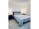 Comfortable bedroom featuring matching nightstands and cool-tone decor at 13186 Thrush St, Spring Hill, FL 34609