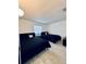 Bedroom featuring two beds, new flooring, and a window with natural light at 13186 Thrush St, Spring Hill, FL 34609