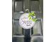 Close-up of a black front door adorned with a decorative 'Home Sweet Home' sign at 13186 Thrush St, Spring Hill, FL 34609
