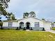 Charming single-story home with well-maintained lawn and inviting front entrance at 13186 Thrush St, Spring Hill, FL 34609