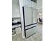 Contemporary kitchen showcasing a large refrigerator adjacent to the coffee bar at 13186 Thrush St, Spring Hill, FL 34609