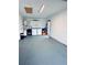 Spacious laundry room with washer, dryer, water heater, and access to the backyard at 13186 Thrush St, Spring Hill, FL 34609
