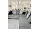 Comfortable living room with a large sectional sofa and decorative pillows at 13186 Thrush St, Spring Hill, FL 34609