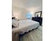 Cozy main bedroom featuring modern wood-look floors and a large dresser at 13186 Thrush St, Spring Hill, FL 34609