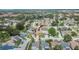 An aerial view shows a house with well-kept landscaping in a residential neighborhood with mature trees at 1331 Coolmont Dr, Brandon, FL 33511