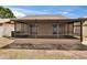 View of the screened-in back patio, with sliding doors opening to the yard at 1331 Coolmont Dr, Brandon, FL 33511