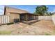 An exterior view of the backyard showcases a patio area and AC unit at 1331 Coolmont Dr, Brandon, FL 33511