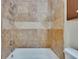 Close-up of bathroom featuring tiled shower, and wooden cabinet for extra storage at 1331 Coolmont Dr, Brandon, FL 33511