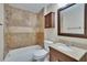 Bathroom featuring a tiled shower, vanity with granite countertops, and wooden cabinet for extra storage at 1331 Coolmont Dr, Brandon, FL 33511