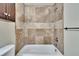 Updated bathroom features a tile-surround bathtub and modern fixtures at 1331 Coolmont Dr, Brandon, FL 33511