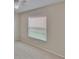 Bright bedroom featuring neutral walls, carpeted flooring, and a window with horizontal blinds at 1331 Coolmont Dr, Brandon, FL 33511
