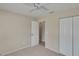 Bedroom with neutral carpet, ceiling fan, and doorway into the ensuite bathroom at 1331 Coolmont Dr, Brandon, FL 33511