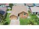 Charming single-Gathering home with stone accents, well-manicured lawn, and mature palm trees at 1331 Coolmont Dr, Brandon, FL 33511
