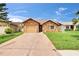 Single-story home with a stone facade, a one-car garage, and a well-maintained front yard at 1331 Coolmont Dr, Brandon, FL 33511