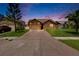 Charming single-story home featuring a stone facade, attached garage, and a well-manicured front lawn at 1331 Coolmont Dr, Brandon, FL 33511
