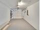 Spacious two car garage with white walls and concrete floor at 1331 Coolmont Dr, Brandon, FL 33511