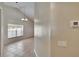 Hallway featuring ceramic tile, thermostat, and lighting fixture at 1331 Coolmont Dr, Brandon, FL 33511