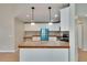 Bright kitchen with white cabinets, modern appliances, and wood-trimmed countertops at 1331 Coolmont Dr, Brandon, FL 33511