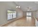 Spacious living room with tile floors, vaulted ceilings, and sliding door access to the outdoors at 1331 Coolmont Dr, Brandon, FL 33511