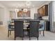 Charming dining area featuring modern chandelier and a view of the kitchen at 13515 Palmera Vista Dr, Riverview, FL 33579