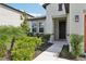 View of front door, featuring landscaped yard at 13515 Palmera Vista Dr, Riverview, FL 33579