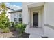 The front entrance features a covered porch and manicured landscaping at 13515 Palmera Vista Dr, Riverview, FL 33579