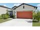 Inviting single-story home with a spacious two-car garage and well-kept landscaping at 13515 Palmera Vista Dr, Riverview, FL 33579