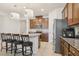 Well-equipped kitchen with granite countertops, stainless steel appliances, and island seating at 13515 Palmera Vista Dr, Riverview, FL 33579