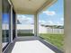 Covered patio offering a view of the fenced backyard with green grass at 13515 Palmera Vista Dr, Riverview, FL 33579