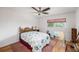 Comfortable bedroom with wood floors, a ceiling fan, and lots of light at 13710 Mission Oaks Blvd # 2A, Seminole, FL 33776