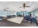 Spacious community center with ample seating, ceiling fans, and a versatile open floor plan for various activities at 13710 Mission Oaks Blvd # 2A, Seminole, FL 33776