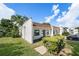 A single-story home with beautiful lawn, mature trees, and a well-maintained exterior at 13710 Mission Oaks Blvd # 2A, Seminole, FL 33776