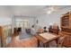 Spacious and bright living area with wood flooring and access to the screened lanai at 13710 Mission Oaks Blvd # 2A, Seminole, FL 33776