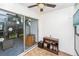 Enclosed patio with view of the backyard; sliding glass doors to living space at 13710 Mission Oaks Blvd # 2A, Seminole, FL 33776