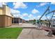 Backyard view with boat dock, boat lift, screened lanai and canal access at 13814 Lavender Ave, Hudson, FL 34667