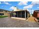 View of the back exterior with a patio with room for activities at 13814 Lavender Ave, Hudson, FL 34667