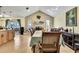 Open-concept dining area with a fireplace, stylish decor, and ample space for entertaining at 13814 Lavender Ave, Hudson, FL 34667