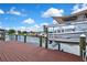 Waterfront view from the dock, featuring boat lifts and easy canal access at 13814 Lavender Ave, Hudson, FL 34667
