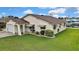 Charming single-story home with well-maintained lawn, attached garage, and canal access at 13814 Lavender Ave, Hudson, FL 34667
