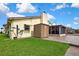 Exterior view showcasing the lush green yard, storage shed, and screened lanai at 13814 Lavender Ave, Hudson, FL 34667