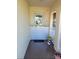 Front door with installed flood barrier at 13814 Lavender Ave, Hudson, FL 34667