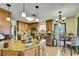 Spacious kitchen featuring an island, ample counter space, and convenient access to dining area at 13814 Lavender Ave, Hudson, FL 34667