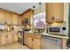 Well-equipped kitchen featuring stainless appliances, granite countertops, and ample cabinetry at 13814 Lavender Ave, Hudson, FL 34667