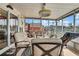 Enclosed patio features comfortable seating and view of the canal at 13814 Lavender Ave, Hudson, FL 34667