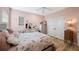 Pink-walled bedroom with an ornate bed, and lots of natural light, plus a ceiling fan at 1391 Marinella Dr, Palm Harbor, FL 34683