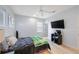 Bedroom with a flat screen television and ample lighting at 1391 Marinella Dr, Palm Harbor, FL 34683