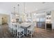 Beautiful kitchen with white cabinets, stainless steel appliances, and a large center island with bar stool seating at 1391 Marinella Dr, Palm Harbor, FL 34683
