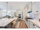 Bright and open kitchen with marble countertops, stainless steel appliances, and seamless access to the living areas at 1391 Marinella Dr, Palm Harbor, FL 34683